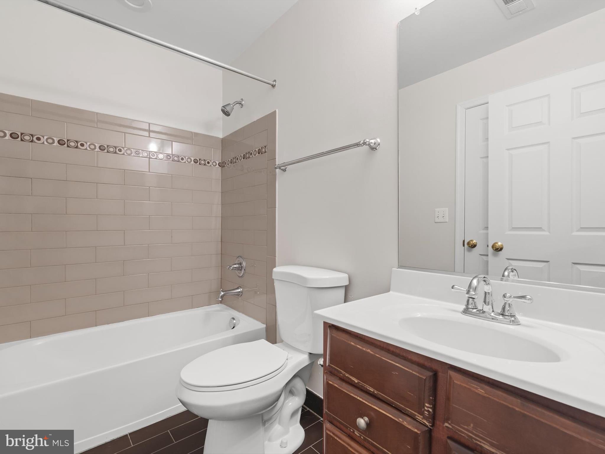 2807 Cornet Court Silver Spring, MD 20904 - Photo 32 of 44 a bathroom with a sink a toilet and shower