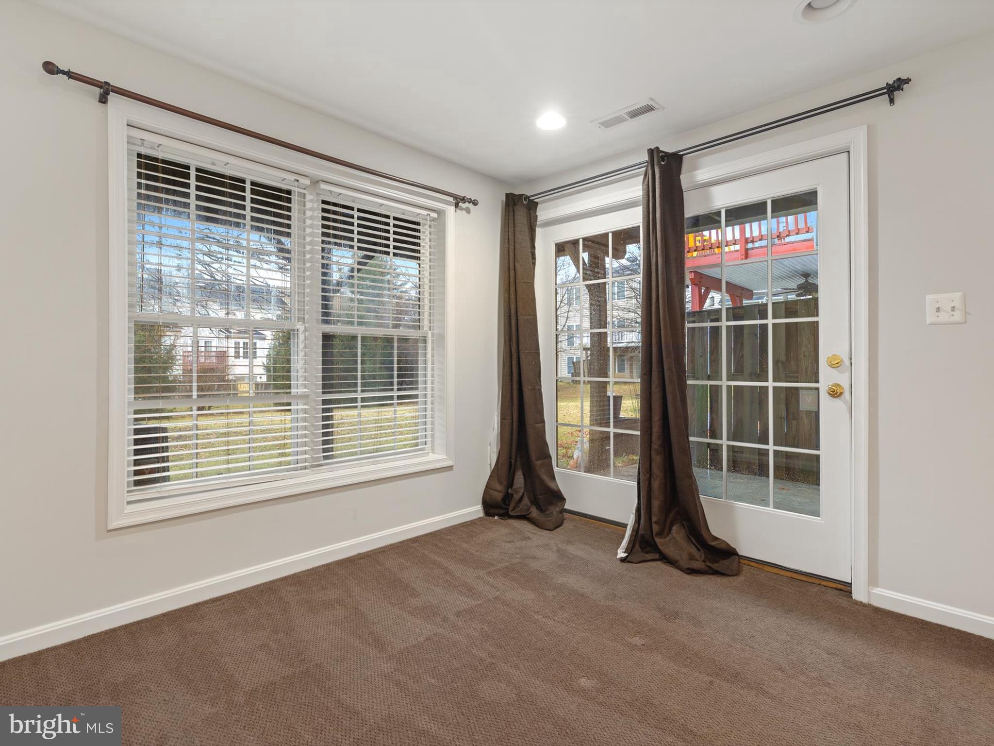 2807 Cornet Court Silver Spring, MD 20904 - Photo 4 of 44 a view of empty room with floor to ceiling window