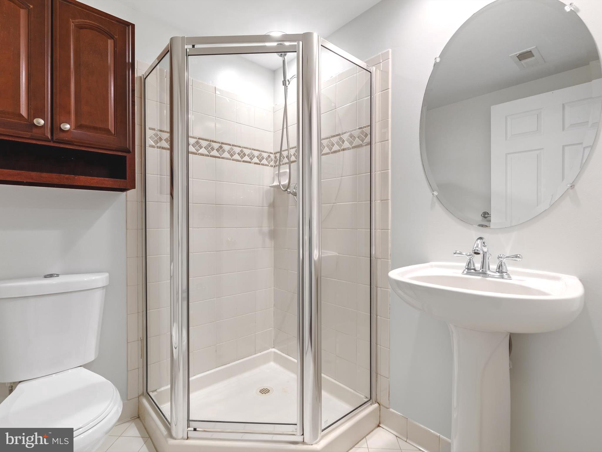 2807 Cornet Court Silver Spring, MD 20904 - Photo 6 of 44 a bathroom with a sink a toilet and shower