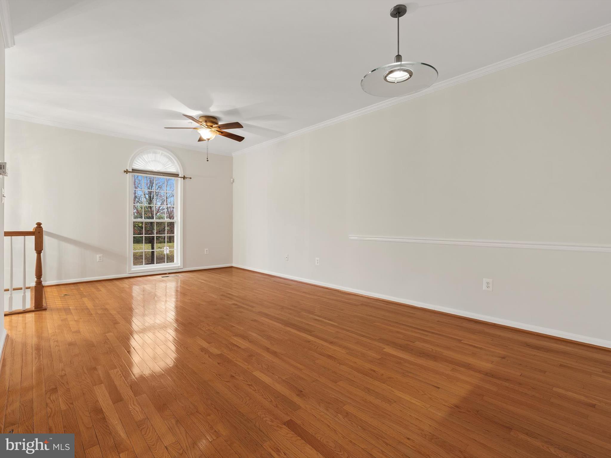 2807 Cornet Court Silver Spring, MD 20904 - Photo 9 of 44 wooden floor in an empty room with a window