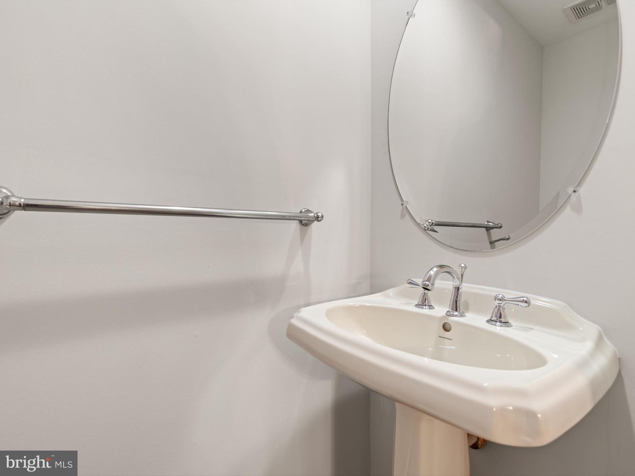2807 Cornet Court Silver Spring, MD 20904 - Photo 10 of 44 a bathroom with a sink a mirror and a shower