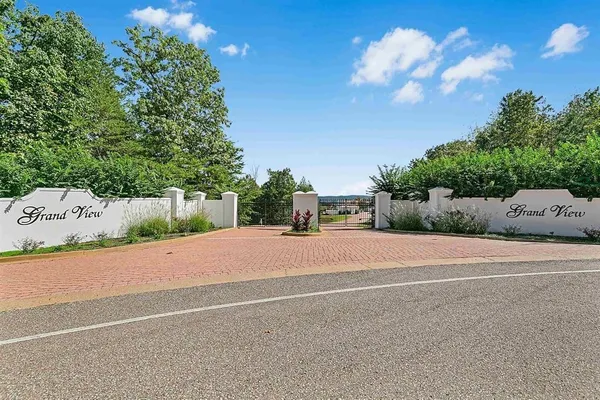 a view of a house with a yard and garage
