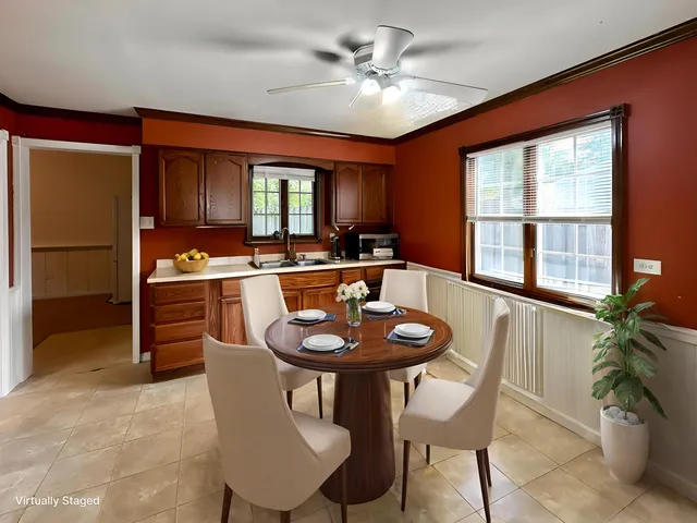 a view of a dining room with furniture window and outside view