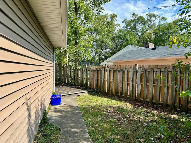a view of small room with wooden fence