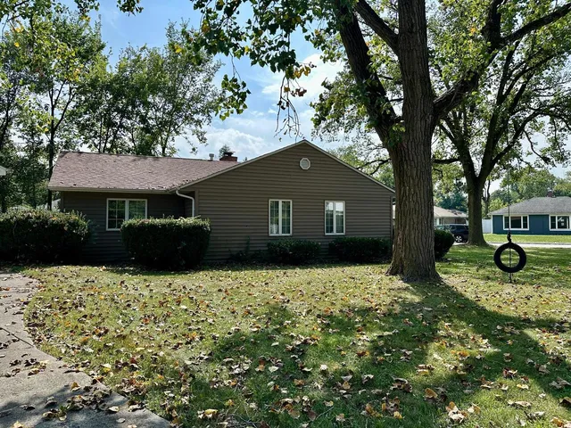 a house with trees in the background