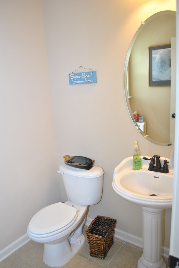 9536 English Ivy Court Fortson, GA 31808 - Photo 11 of 22 a bathroom with a toilet a sink and mirror