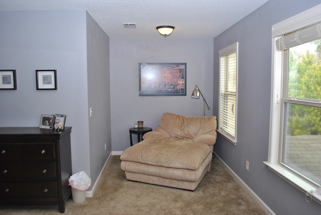9536 English Ivy Court Fortson, GA 31808 - Photo 13 of 22 a living room with furniture and a flat screen tv