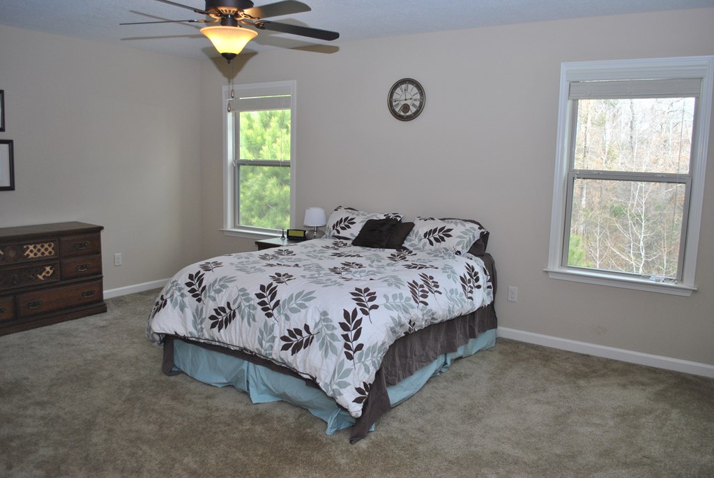 9536 English Ivy Court Fortson, GA 31808 - Photo 16 of 22 a bedroom with a bed and a window