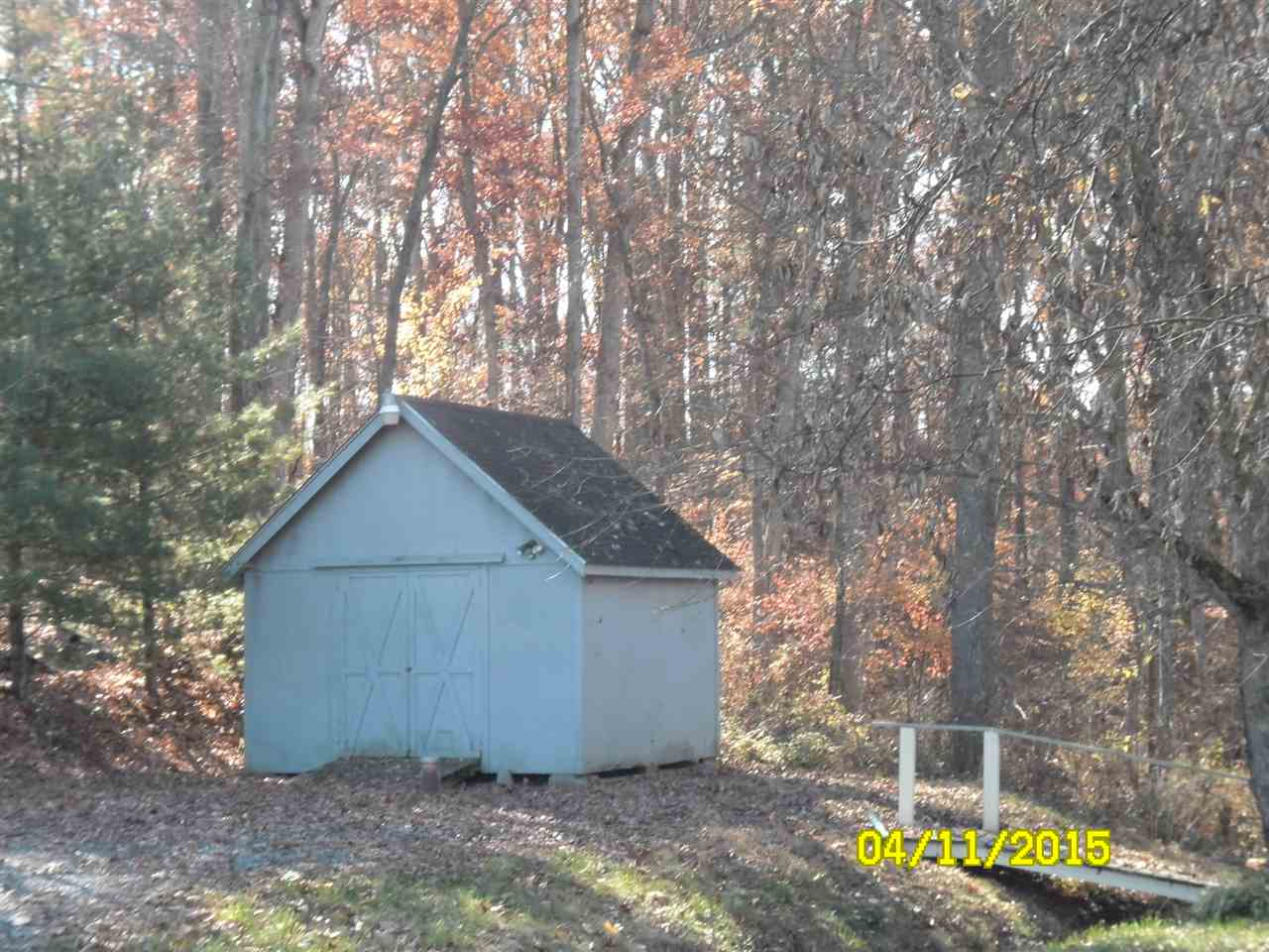 761 Patterson Mill Road Grottoes, VA 24441 - Photo 19 of 24 a wooden house with trees in front of it
