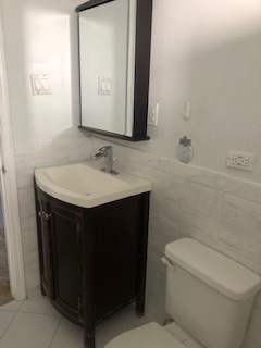 3347 Thornberry Lane Glenview, IL 60025 - Photo 9 of 12 a bathroom with a sink a toilet and mirror