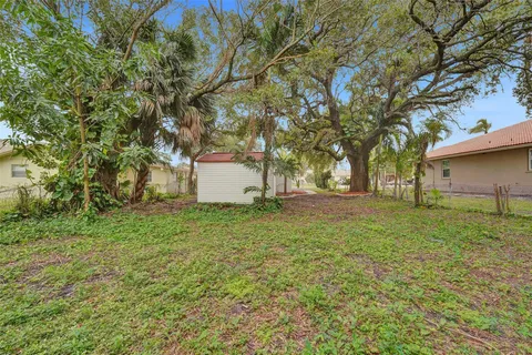 a view of outdoor space with deck and yard