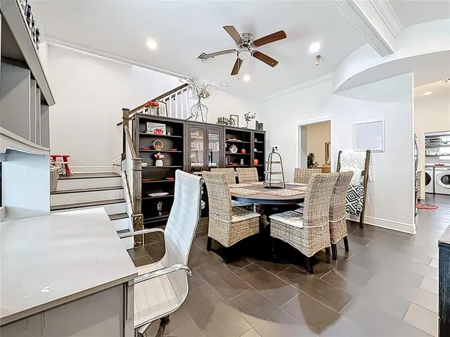 a bedroom with a bed wooden floor and a flat screen tv