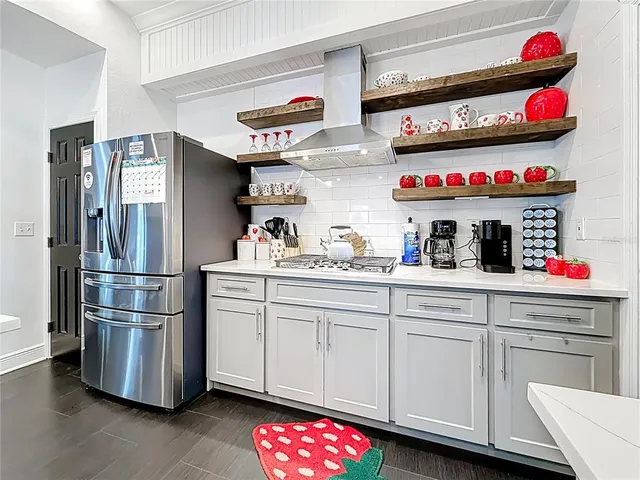 a view of a dinning table and chairs in patio of the house