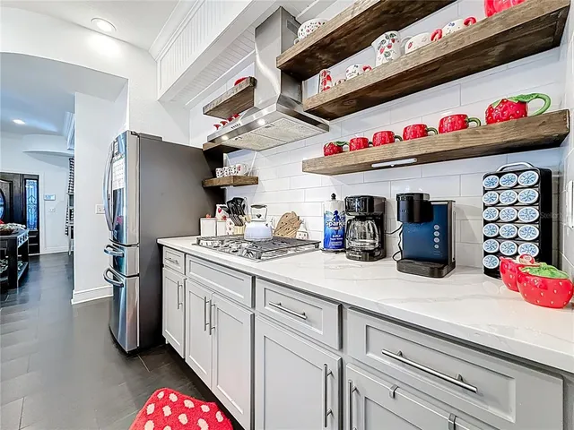 a bathroom with a sink toilet vanity and shower