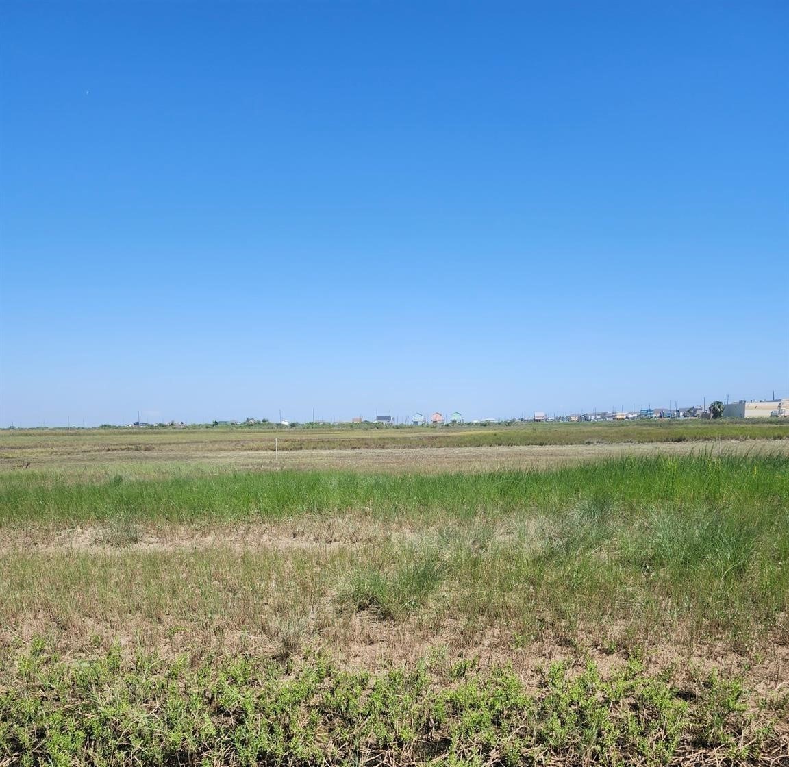 0 Nesmith Place Surfside Beach, TX 77541 - Photo 1 of 6 a view of an ocean and beach