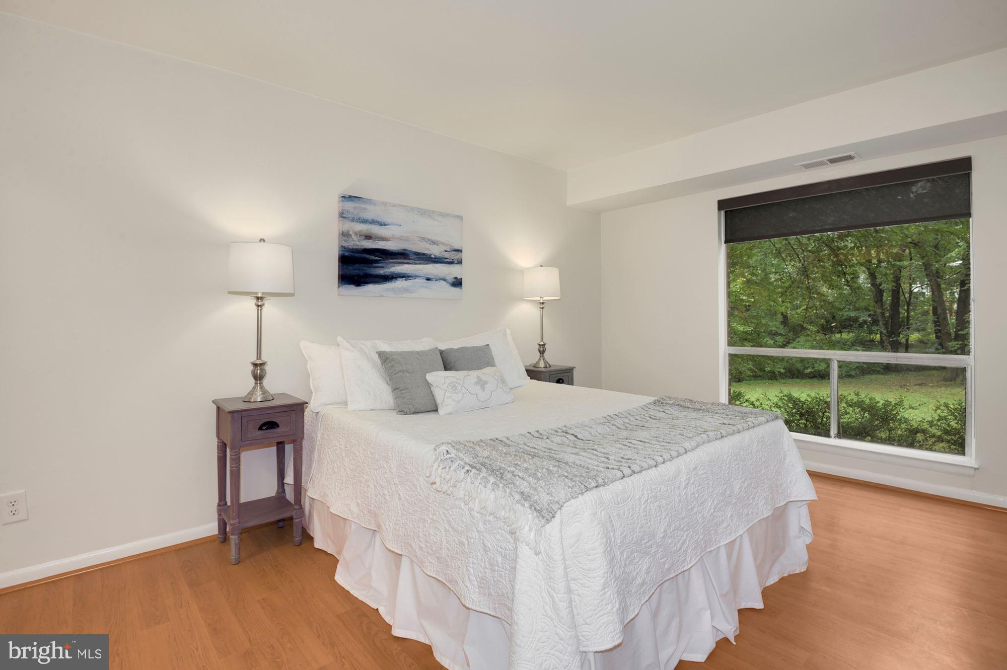 11627 Vantage Hill Road, Unit 1A Reston, VA 20190 - Photo 10 of 27 Bedroom looks out to trees and lawn