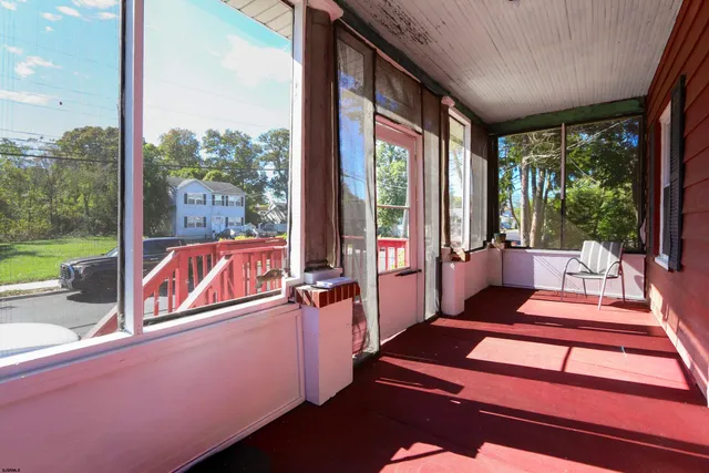 a living room with large windows