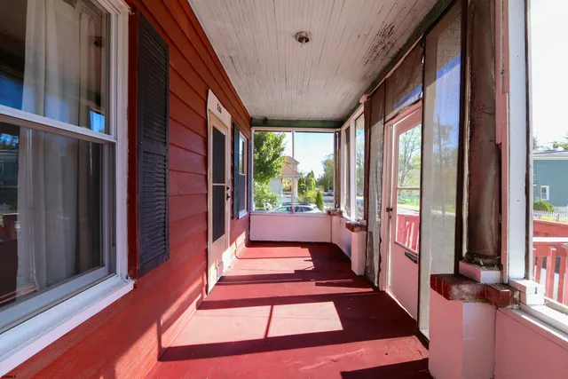 a view of balcony and wooden floor