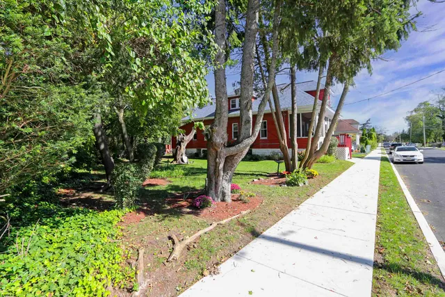 a view of a backyard with swimming pool