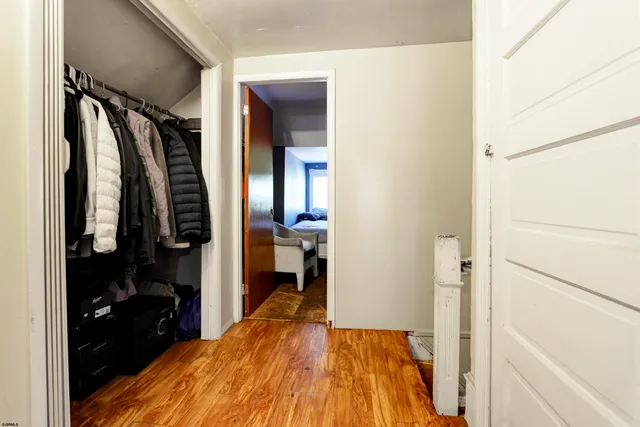 a bed room with a bed and a mirror