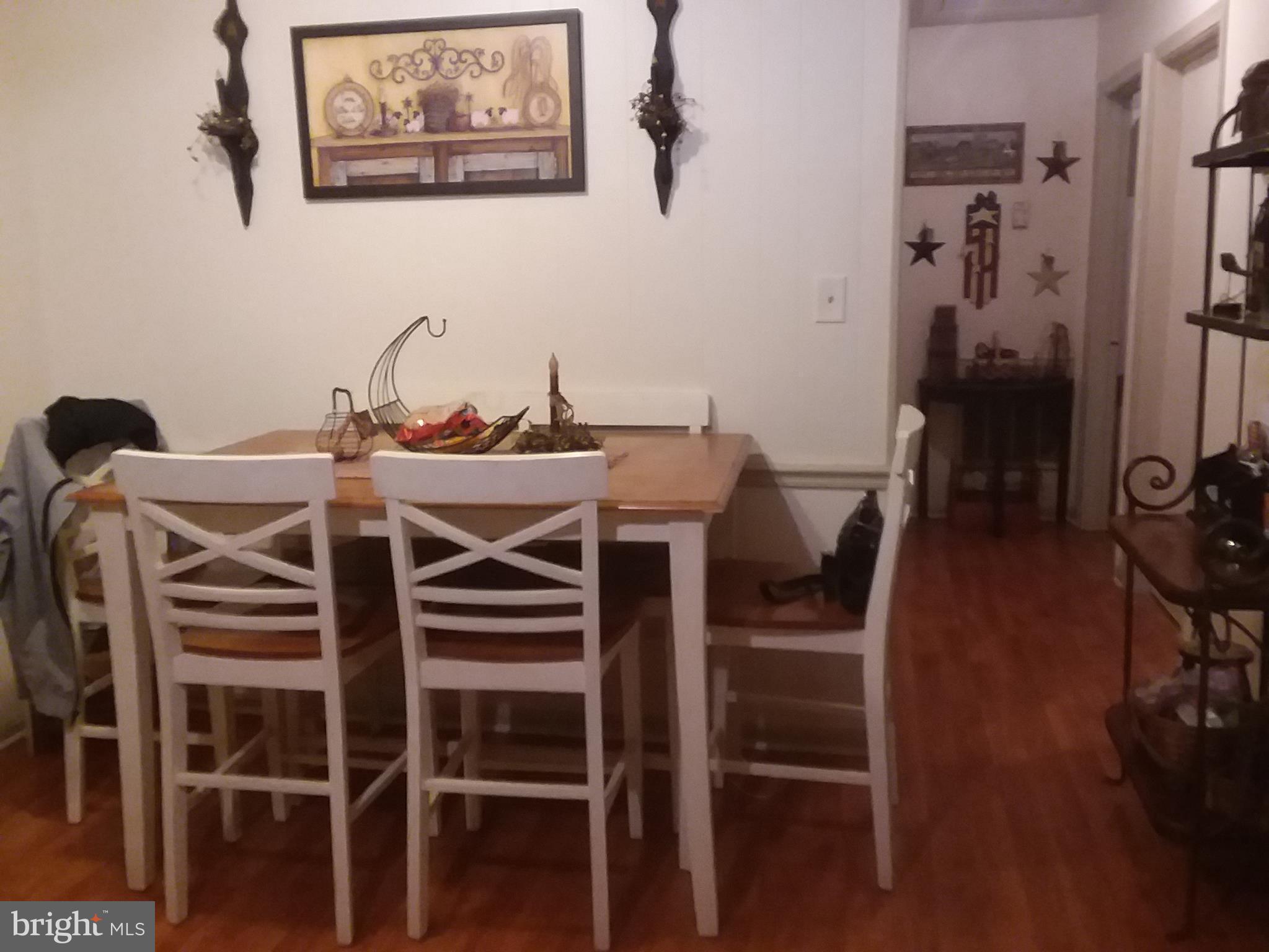 6186 Slate Mills Road Boston, VA 22713 - Photo 3 of 11 a view of a dining room with furniture and wooden floor