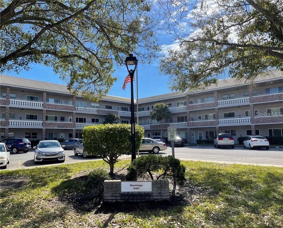 2461 Rhodesian Drive, Unit 31 Clearwater, FL 33763 - Photo 1 of 1 a building view with swimming pool and outdoor seating