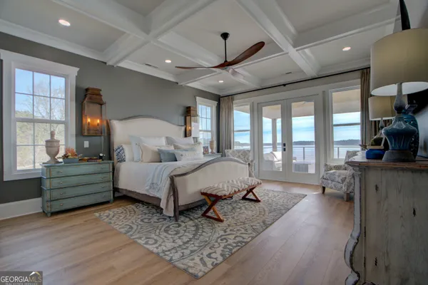 a bed room with furniture and a large window