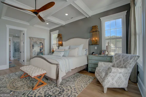 a bedroom with furniture and a window