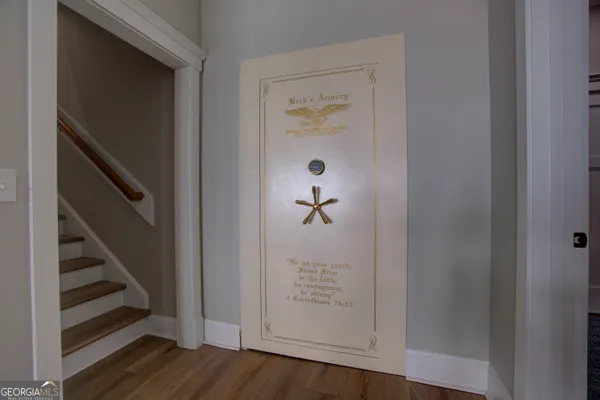 a view of front door with wooden floor