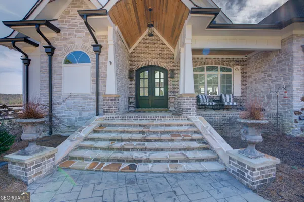 a front view of a house with garden