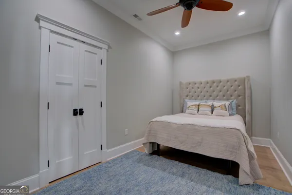 a bedroom with a bed and a table