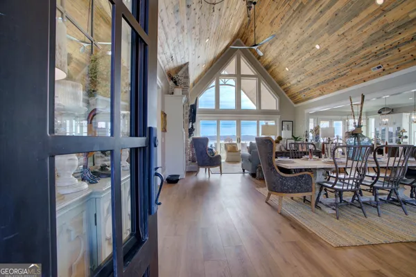 a view of a livingroom with furniture and a window