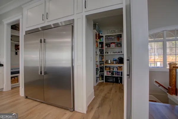 a view of a room with wooden floor and closet