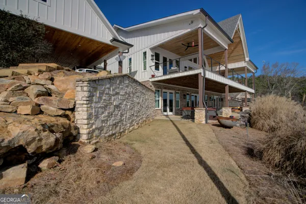 a view of a house with wooden deck