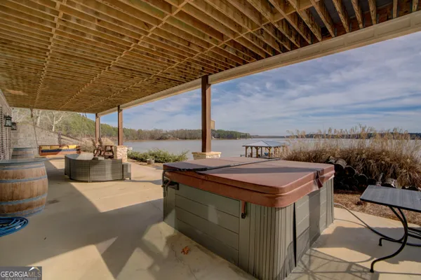 a view of a patio with a table and chairs