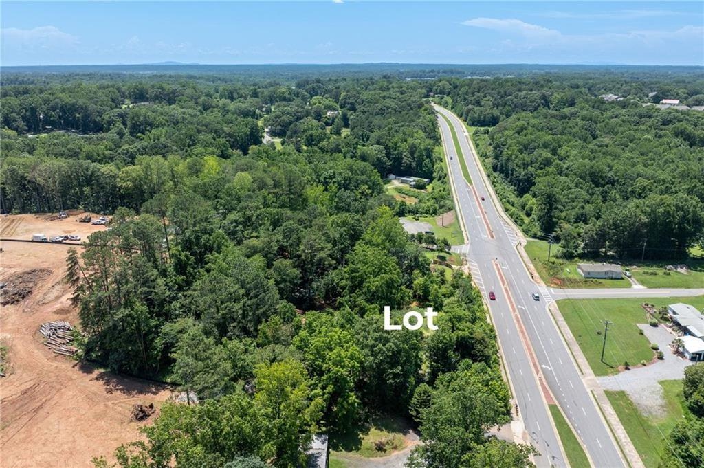 3815 Castleberry Road Cumming, GA 30040 - Photo 4 of 10 an aerial view of residential house with outdoor space and trees all around