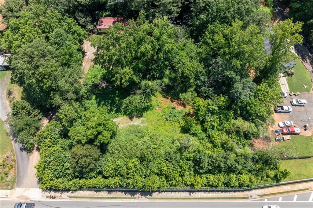 3815 Castleberry Road Cumming, GA 30040 - Photo 8 of 10 an aerial view of residential house with outdoor space and trees all around