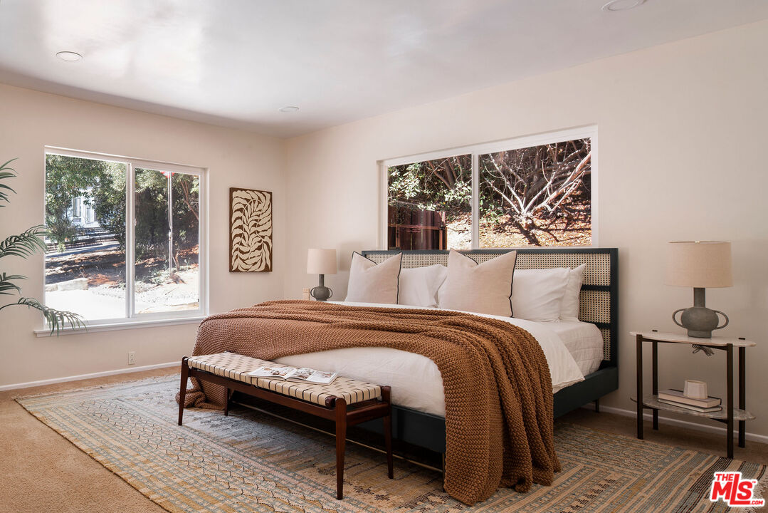 478 Devonwood Road Altadena, CA 91001 - Photo 17 of 42 a bedroom with a bed and wooden floor