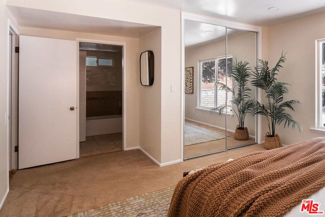 478 Devonwood Road Altadena, CA 91001 - Photo 18 of 42 a bedroom with a bed and a potted plant in it