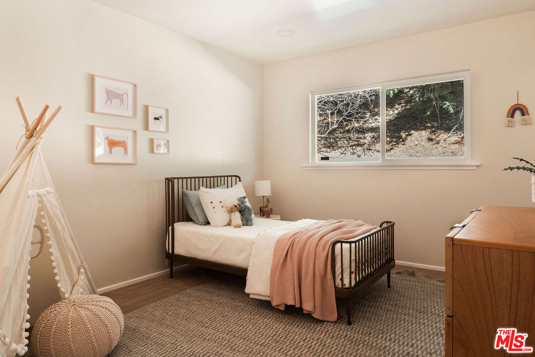 478 Devonwood Road Altadena, CA 91001 - Photo 25 of 42 a bedroom with a bed and a window