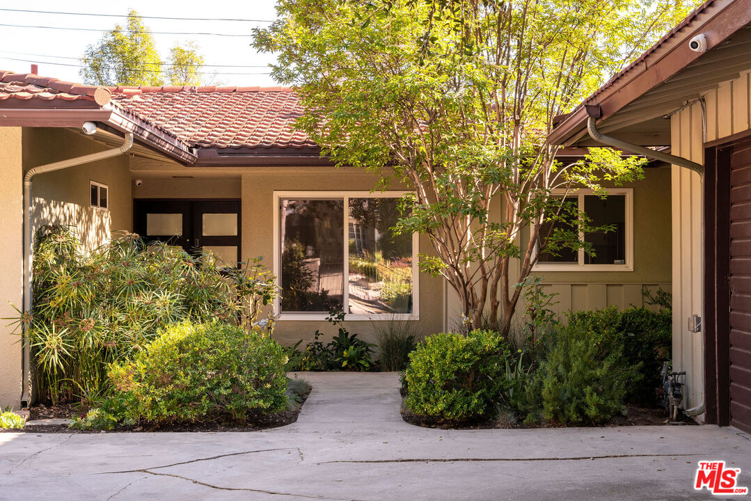478 Devonwood Road Altadena, CA 91001 - Photo 3 of 42 a front view of a house with garden