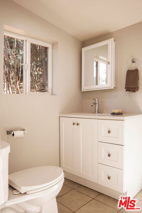 478 Devonwood Road Altadena, CA 91001 - Photo 32 of 42 a bathroom with a granite countertop sink mirror vanity and toilet