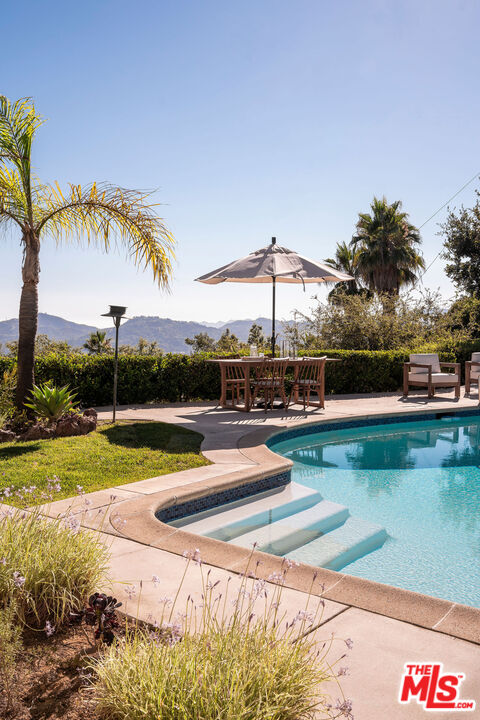 478 Devonwood Road Altadena, CA 91001 - Photo 34 of 42 a view of a house with pool and chairs