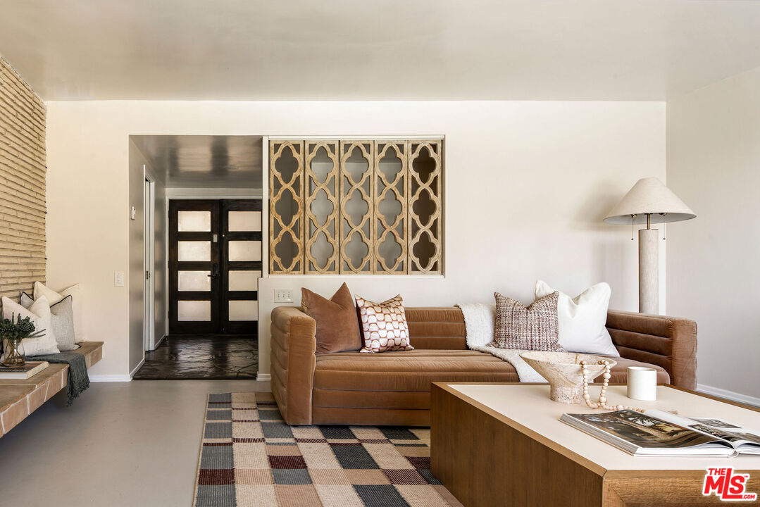 478 Devonwood Road Altadena, CA 91001 - Photo 4 of 42 a bedroom with a bed and a couch