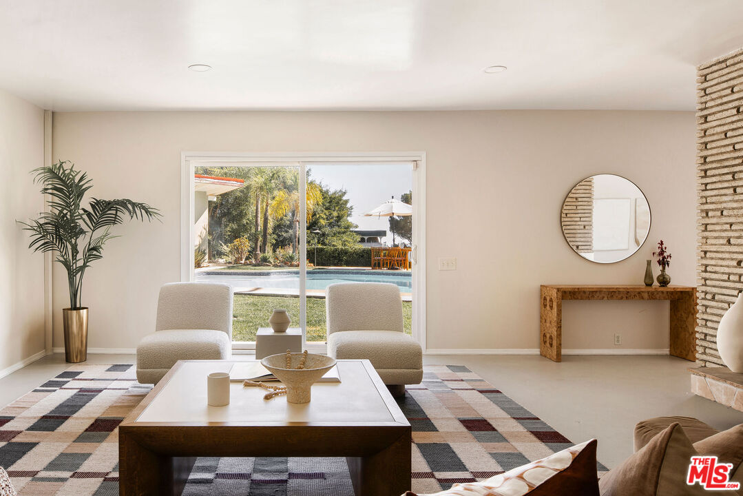 478 Devonwood Road Altadena, CA 91001 - Photo 7 of 42 a living room with furniture a window and a potted plant