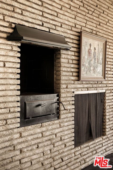 478 Devonwood Road Altadena, CA 91001 - Photo 10 of 42 a living room with a stove and a refrigerator