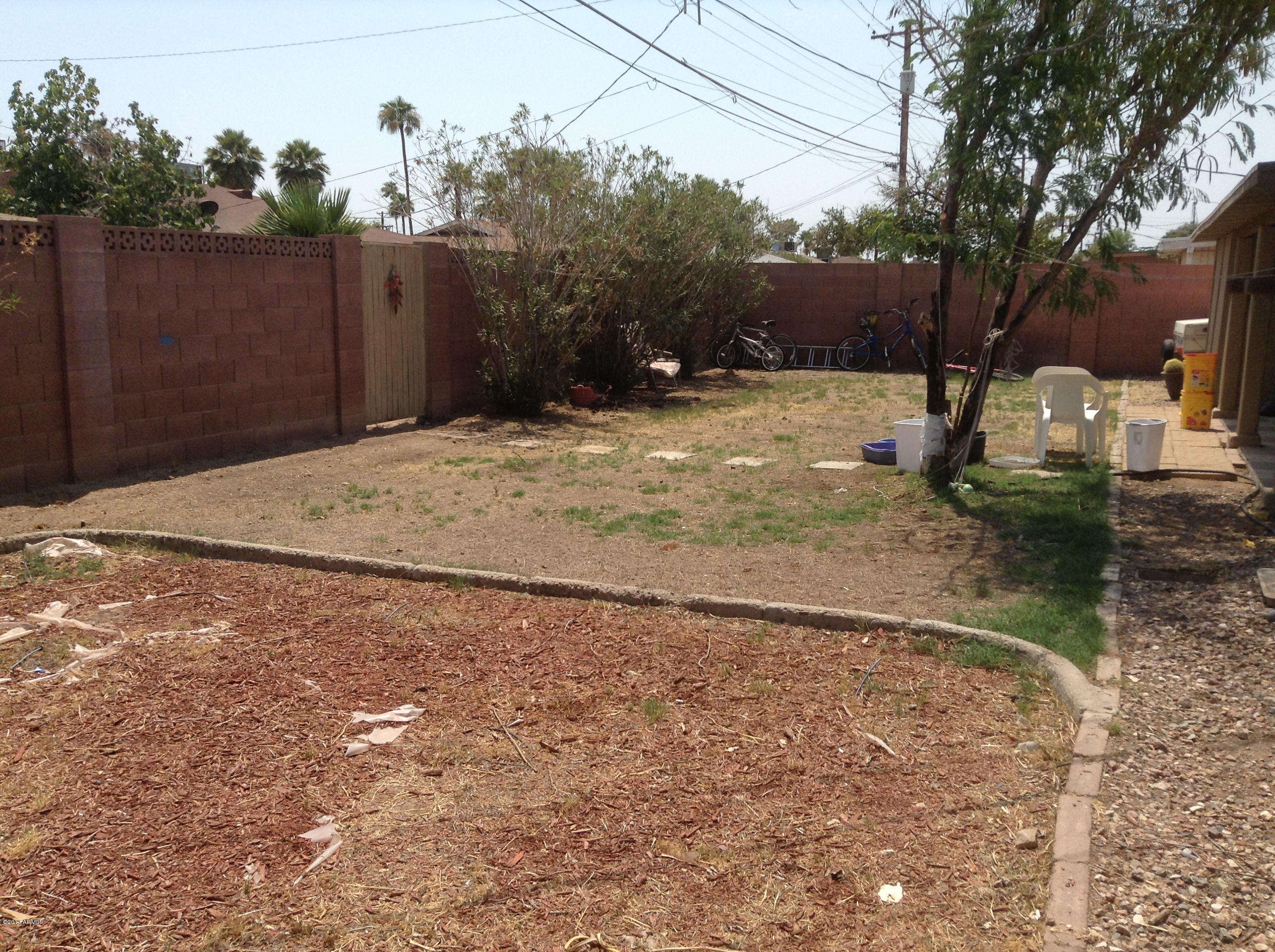 3531 West Lawrence Road Phoenix, AZ 85019 - Photo 9 of 11 BackYard w/Block Fence