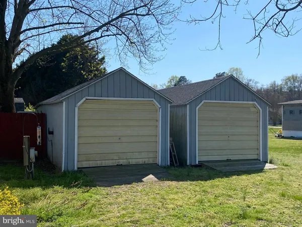 a view of a house with a small yard