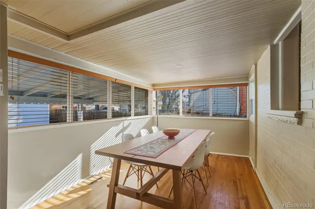 a view of a patio with a table and chairs