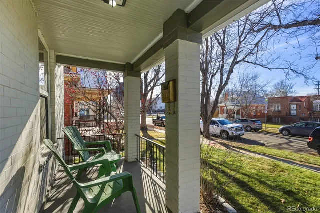 a view of a chairs and table in the balcony